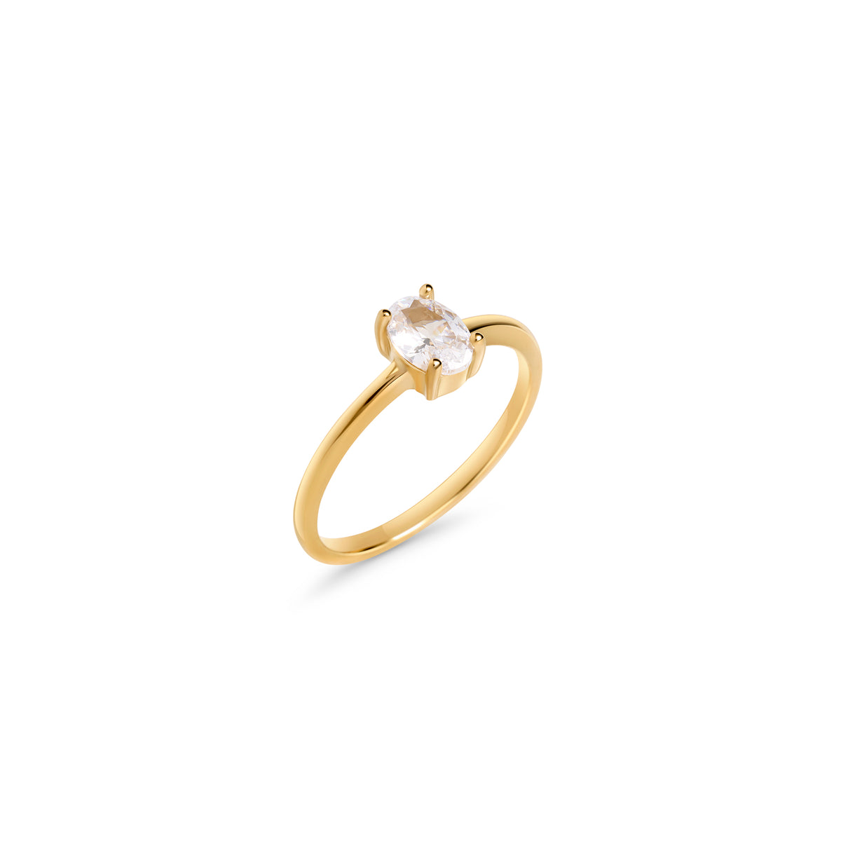 Delicate gold ring set with a single oval clear stone on a white background. Nickel-free, waterproof & tarnish-resistant stainless steel ring for sensitive skin, minimalist luxury jewelry by Mia Bijoux Canada.

Bague délicate dorée sertie d'une seule pierre transparente ovale sur fond blanc. Bague en acier inoxydable sans nickel, résistante à l'eau et anti-ternissement pour peaux sensibles, bijouterie de luxe minimaliste par Mia Bijoux Canada.